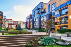 Modern complex of apartment residential buildings. With staircase, fountain, and other outdoor facilities.